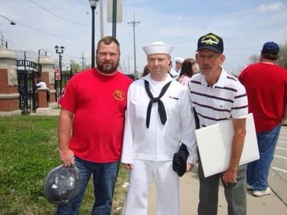 Paul Short is flanked by his brother, Matthew, and father, Steven, at the Navy's boot camp graduation in Great Lakes, Illinois.