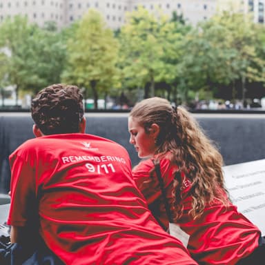 Two students reflecting at the 9/11 memorial. 
Source: 240927-Watts GSF-85